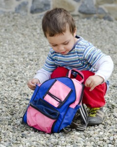 Child Opening His Bag